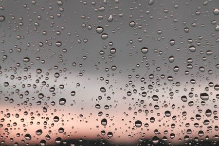 Drops of rain on the window, rainy day. Shallow DOFの写真素材