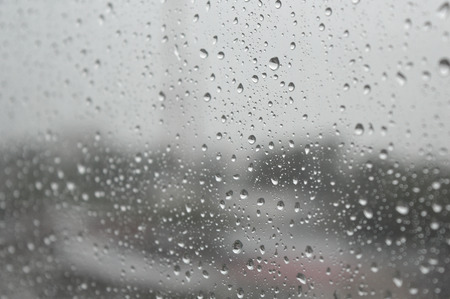 Drops of rain on the window, rainy day. Shallow DOFの写真素材