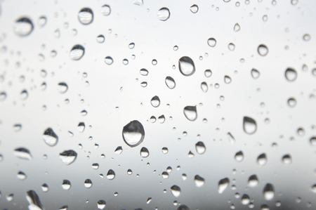 Drops of rain on the window, rainy day. Shallow DOFの写真素材