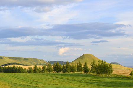 summer landscape with mountain and blue sky with cloudsの写真素材