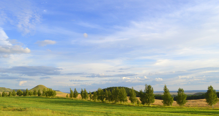 summer landscape with mountain and blue sky with cloudsの写真素材
