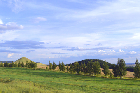 summer landscape with mountain and blue sky with cloudsの写真素材