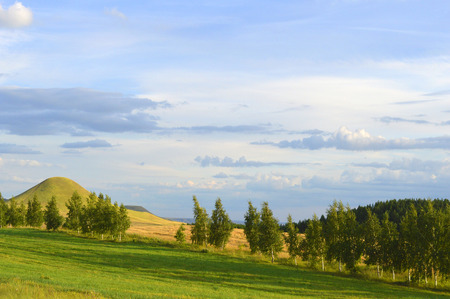 summer landscape with mountain and blue sky with cloudsの写真素材