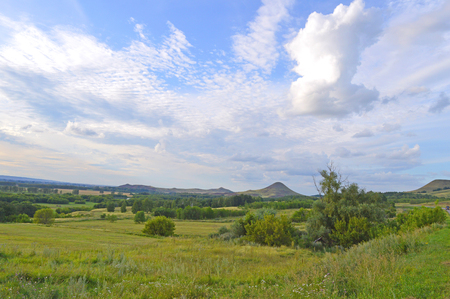 summer landscape with mountain and blue sky with cloudsの写真素材