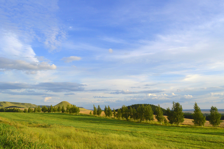 summer landscape with mountain and blue sky with cloudsの写真素材