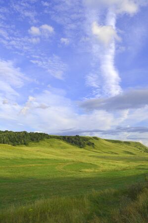 summer landscape with mountain and blue sky with cloudsの写真素材