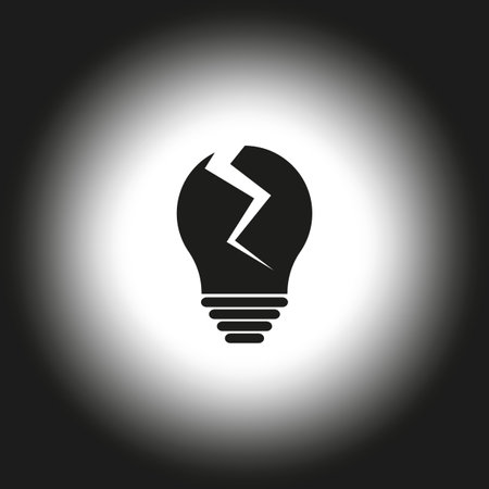 Cracked lightbulb icon. Broken bulb design. Black and white gradient. Damaged idea concept.のイラスト素材