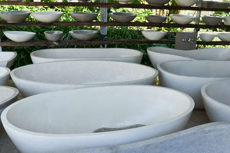 Natural stone baths are made at the factory. Bath and sink productionの写真素材