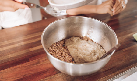 Girls bake oatmeal cookies at home. Household chores before the holidayの写真素材