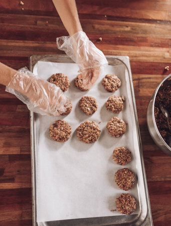 Woman baking oat cookies. Female hands. Vegan food. Home made. Freshの写真素材