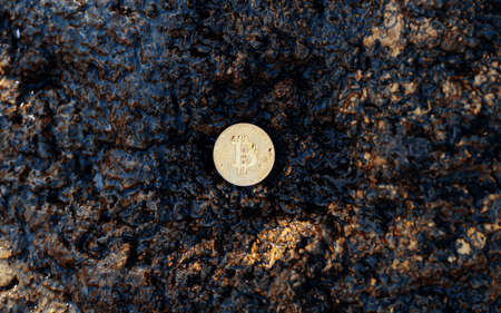 Bitcoin gold coin. Crypto coin in natural stonesの写真素材