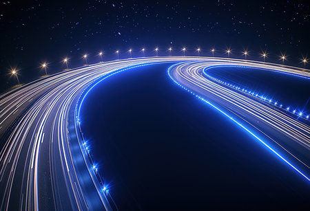Illuminated highways under a starry night sky, a breathtaking display of light trails and stars - perfect for backgrounds and wallpapersの素材