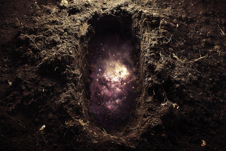 An open grave reveals a dreamlike view of the universe, with stars and nebulas visible beneath the dark soil. The contrasting elements evoke thoughts on life and the cosmos.の素材