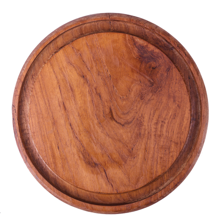 Old round cutting board isolated on white.の写真素材