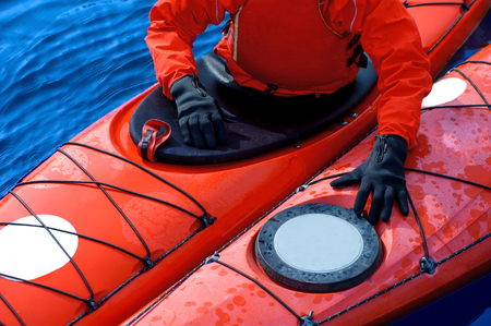 man in winter sportswear in a kayak の写真素材