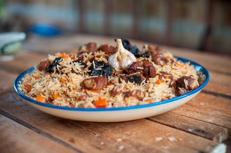 Basmati rice pilaf with pepper, onion prunes, garlic and beefの写真素材