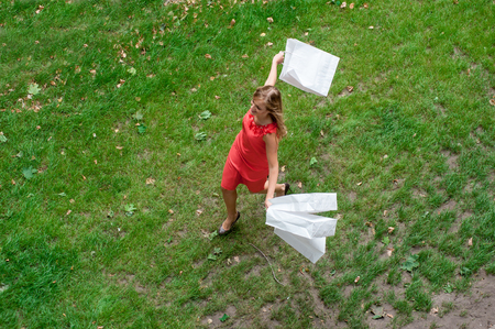 Woman with shopper white packs run happy runningの写真素材