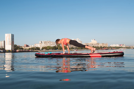 SUP Stand up paddle board woman paddle boardingの写真素材