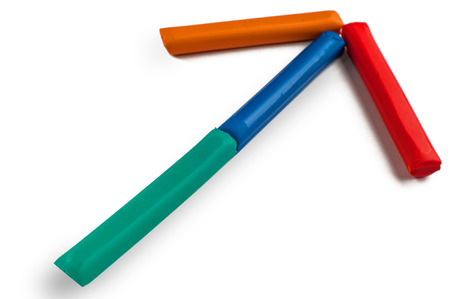 figure from colored plasticine, arrow on a white background isolated