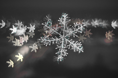 snowflake on colorful bokeh background, snowflake with blurred background.の写真素材