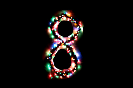 created figure 8 from a colorful bokeh on a black background.International women's day.March 8.の写真素材