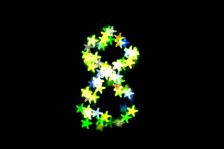 created figure 8 from a colorful bokeh on a black background.International women's day.March 8.の写真素材