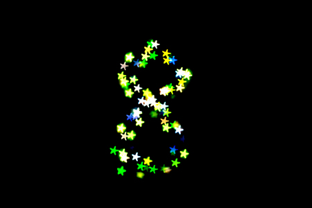 created figure 8 from a colorful bokeh on a black background.International women's day.March 8.の写真素材