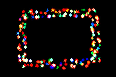 colorful stars form a frame.bokeh stars isolated on black background.frame of stars.の写真素材