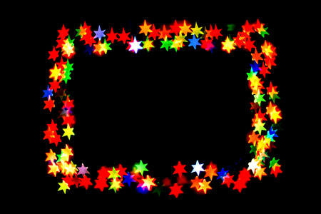 colorful stars form a frame.bokeh stars isolated on black background.frame of stars.の写真素材