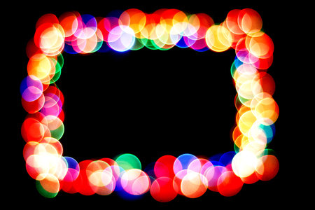 bokeh circles isolated on a black background circles of different colors form a frame.の写真素材