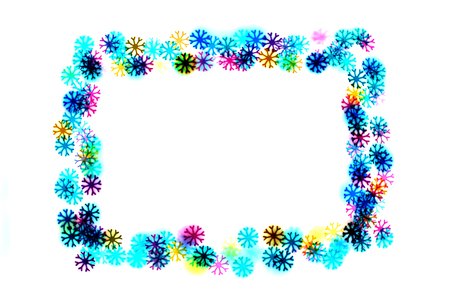 colorful snowflakes form a frame.bokeh snowflakes isolated on white background.photo negative.の写真素材