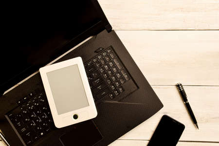 Remote work with laptop at the wooden tableのeditorial素材