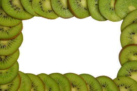 Kiwi slices lie around the entire perimeter of the photo. In the center of the frame is a white clipping background for an inscription or advertisementの写真素材