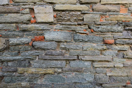 The texture of the stone, laid out on the wall, of different shapes and shades for the entire frame
