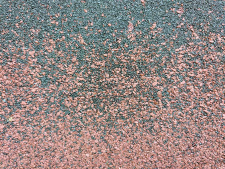 Close-up of a two-tone hard surfacing of a sports field with a soft color transition
