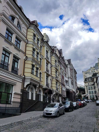 Old houses of the historic quarter with cars near them in perspective with a wide angle viewの写真素材