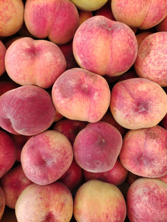 Harvest of ripe peaches full screen. Photo of natural summer food