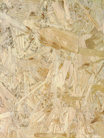 Close-up of a pressed wood panel with a nice fiber structure on the whole background. Building and...