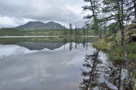 Water summer landscape surrounding the river Suntar in the Highlands of Oymyakon, Yakutia, Russia.の写真素材