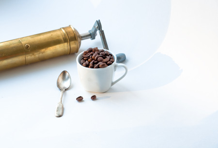 White coffee Cup, in which piled roasted coffee beans の写真素材