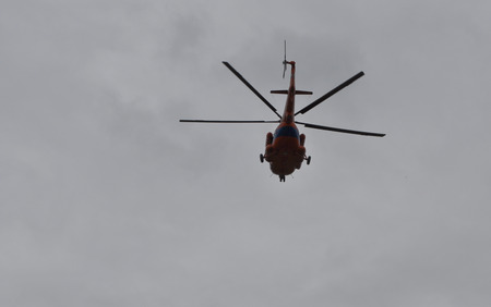 Helicopter rescue service. Rescue service of Yakutia organizes the search for the missing tourists.の写真素材