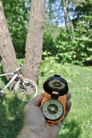 Spring forest as a place for walks and orientation on the terrain. A journey by bike with a compass.