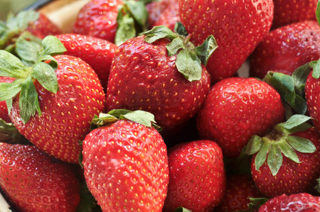 A bowl of strawberries  Ripe berries, strawberry, lit by the rays of the sun 