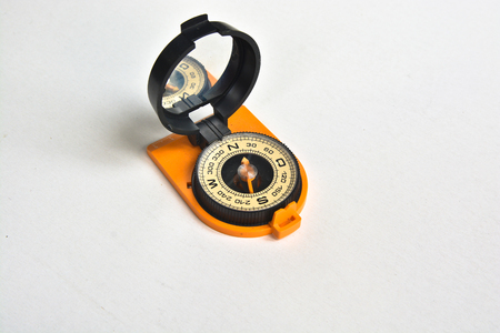 Compass. Photo of magnetic compass on white background.の写真素材