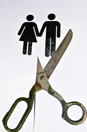 The divorce and separation. A symbolic representation of the decay of a pair of men and women.の写真素材