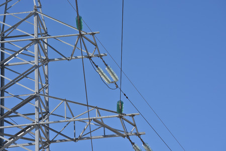 Tower power lines. Photo of towers of transmission lines against the blue sky.