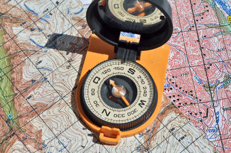 Compass on the map - this is the open door to the country adventure. Open compass on the maps.の写真素材