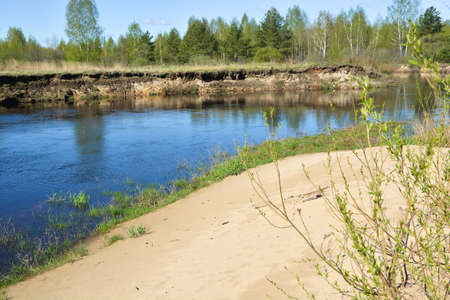 The beginning of may on a protected river. Spring landscape, the river and the first greens in the trees.の写真素材