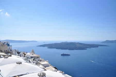 Greek Mediterranean landscape. The Island Of Santorini. The rocky coast of the island in the Aegean sea.の写真素材