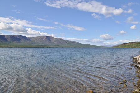 A summer day at North lake. The landscape of the Siberian lake on a Sunny day.の写真素材